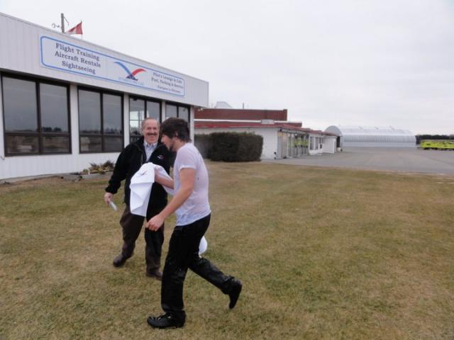 The Presidents hands Ryan an OFC towel to dry off: Marc Desjardins gives Ryan an OFC Towel which he keeps as a momento of his First Solo